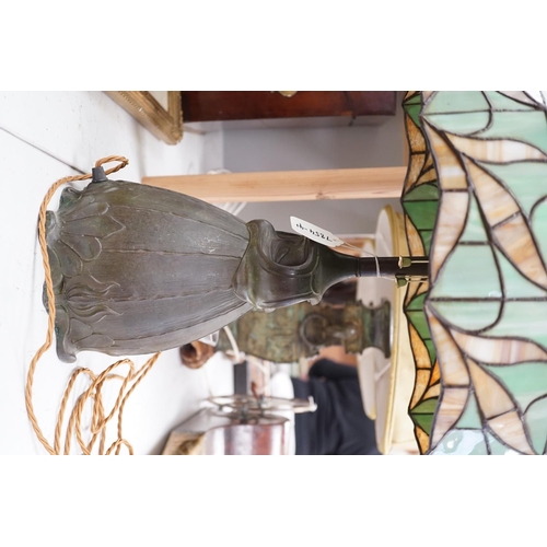 1316 - A spelter lamp with Tiffany style shade, 57cms high including shade