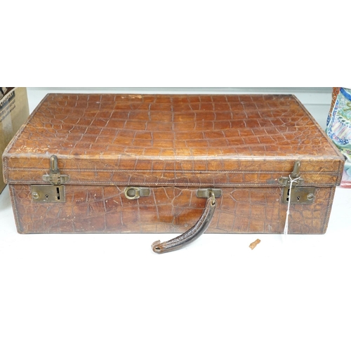 1326 - An early 20th century crocodile skin suitcase - 60cm wide