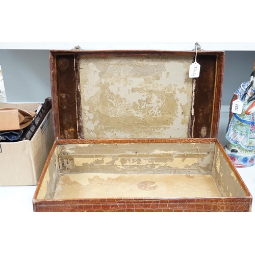 1326 - An early 20th century crocodile skin suitcase - 60cm wide