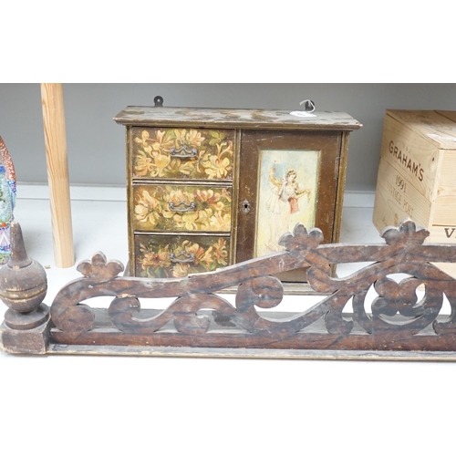 1328 - A painted wood hanging wall cupboard and a fret carved and grained wood pediment, 124cm