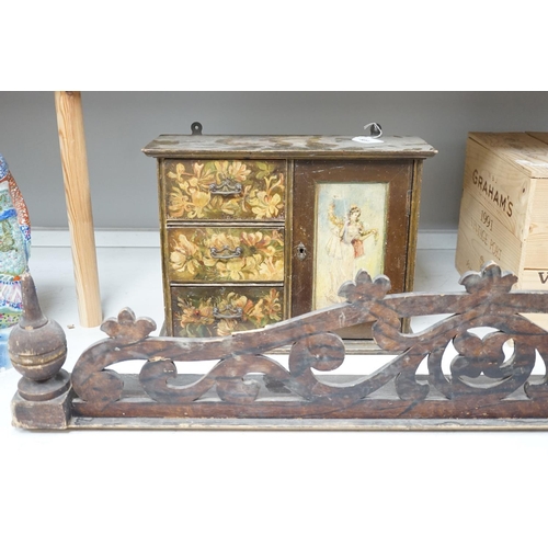 1328 - A painted wood hanging wall cupboard and a fret carved and grained wood pediment, 124cm