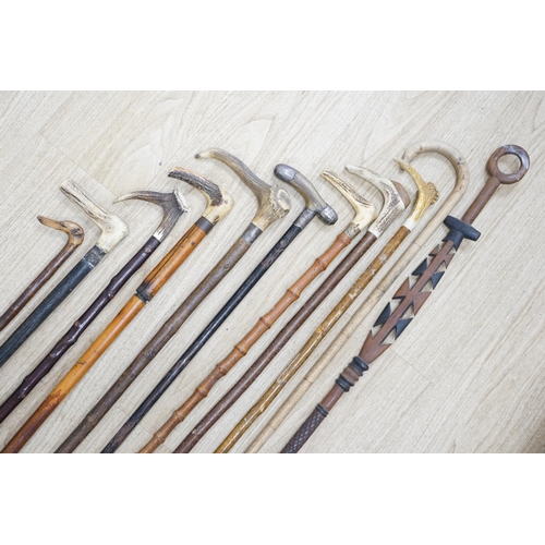 1330 - Twelve assorted walking sticks including silver mounted and staghorn handled