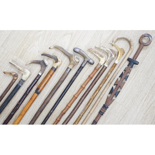 1330 - Twelve assorted walking sticks including silver mounted and staghorn handled