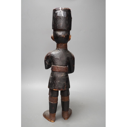 1372 - A late 19th century Belgian Congo carved wood figure of a sepoy  Height 44 cm