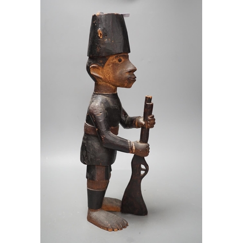 1372 - A late 19th century Belgian Congo carved wood figure of a sepoy  Height 44 cm