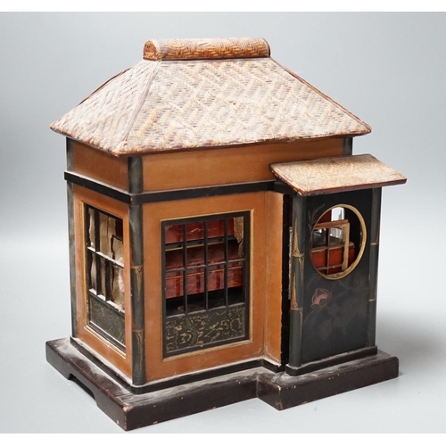 1488 - A Japanese lacquer 'house' with pitched wicker roof and opening side and front sections revealing in... 