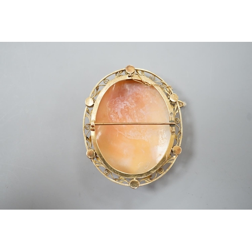 1891 - After the antique- A yellow metal mounted oval cameo shell brooch, carved with the head of a Zeus to... 