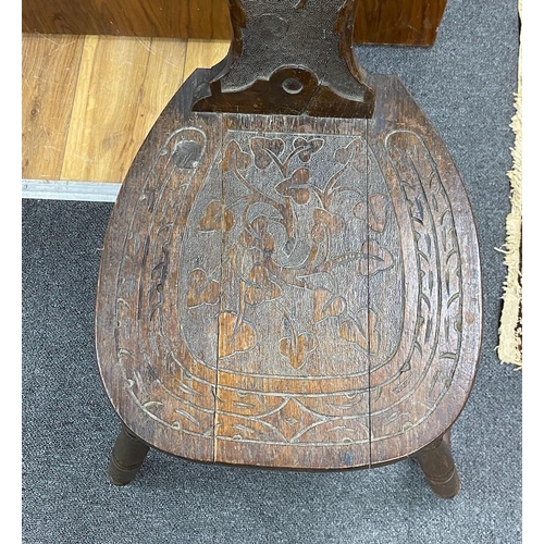 130 - A Victorian carved oak spinning chair, by repute made from the timbers of HMS Foudroyant, dated 1897... 