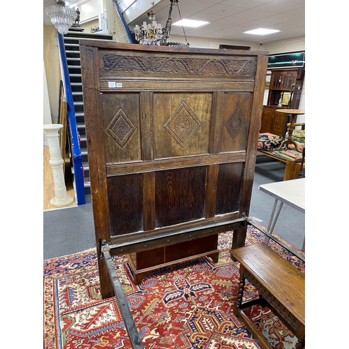 132 - A 17th century style carved oak single head and foot bedstead, length 210cm, width 127cm, height 172... 