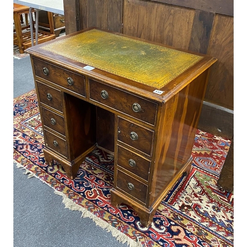 133 - A reproduction 18th century style yew kneehole desk, length 76cm, depth 50cm, height 75cm