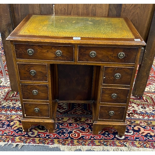 133 - A reproduction 18th century style yew kneehole desk, length 76cm, depth 50cm, height 75cm