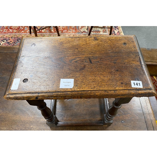 141 - A 17th century style oak joint stool, width 45cm, depth 26cm, height 50cm