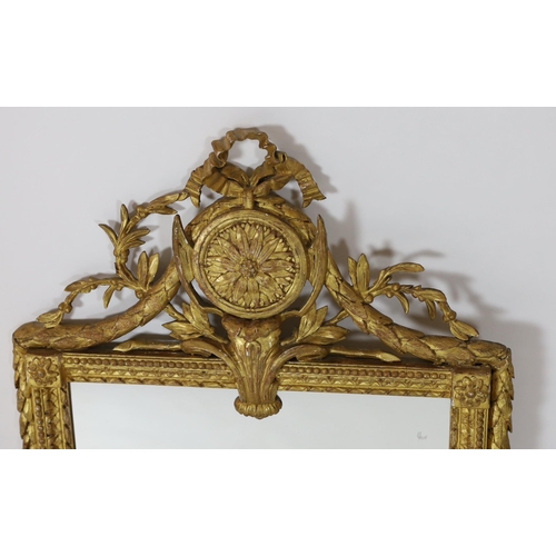 155 - An early 19th century French gilt wood and gesso wall mirror, with ribbon, paterae and laurel leaf c... 