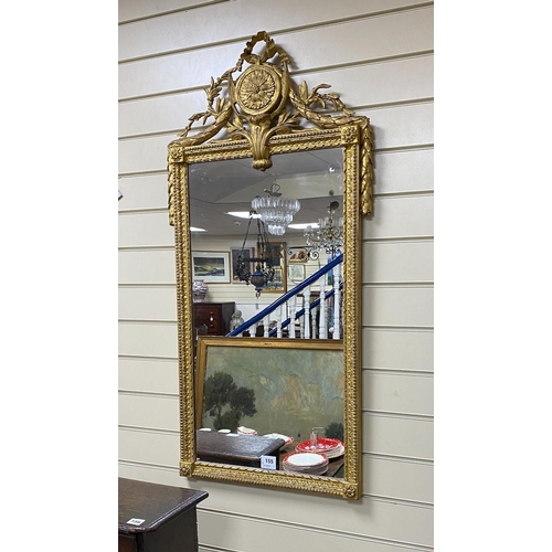 155 - An early 19th century French gilt wood and gesso wall mirror, with ribbon, paterae and laurel leaf c... 