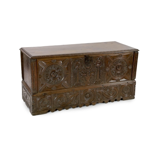 161 - An 18th century Spanish chestnut coffer, carved in relief with a central fountain flanked by stylise... 