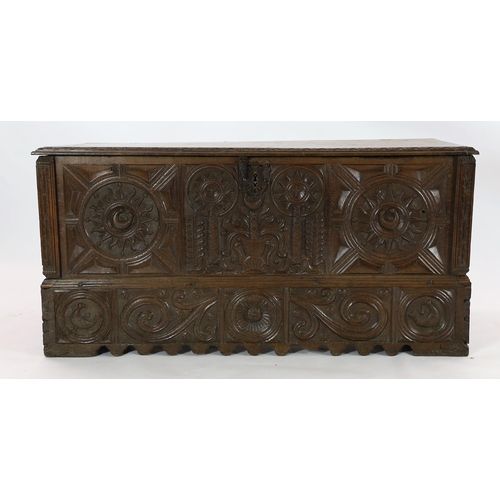 161 - An 18th century Spanish chestnut coffer, carved in relief with a central fountain flanked by stylise... 