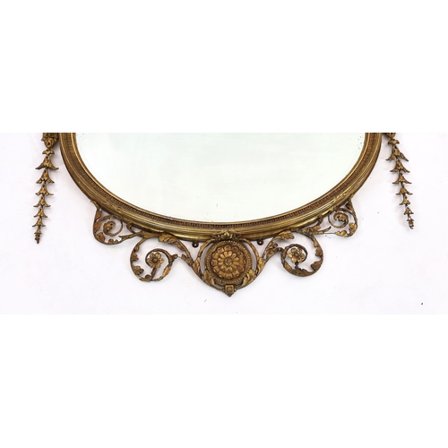 165 - A late Victorian Adam Revival oval wall mirror, with urn, foliate scroll, ribbon and harebell motifs... 