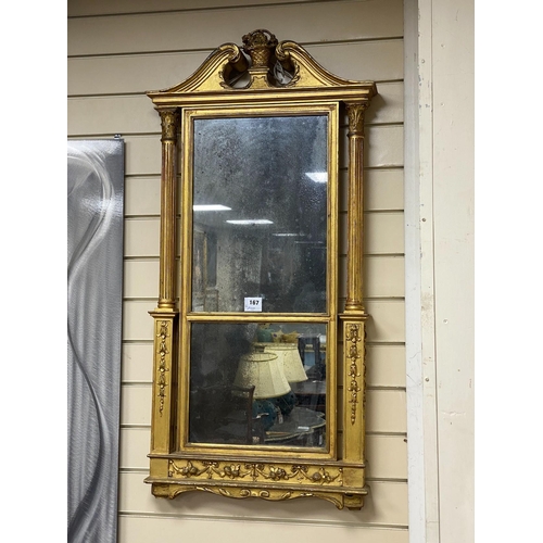 167 - A George III giltwood pier glass, the tabernacle style frame with flowers in a basket and swans neck... 