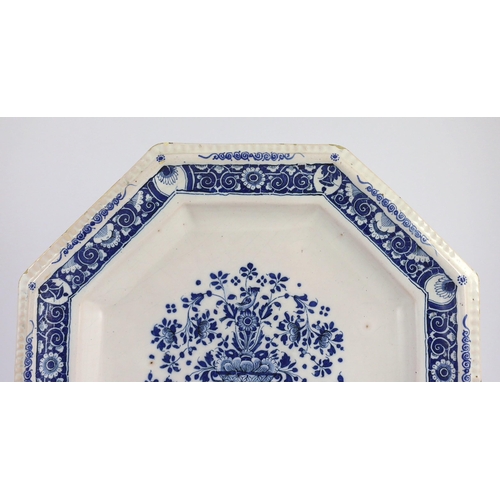 259 - A large Strasbourg faience octagonal dish, c.1720-40, painted in blue with a basket of flowers, with... 