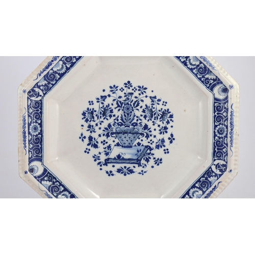 259 - A large Strasbourg faience octagonal dish, c.1720-40, painted in blue with a basket of flowers, with... 