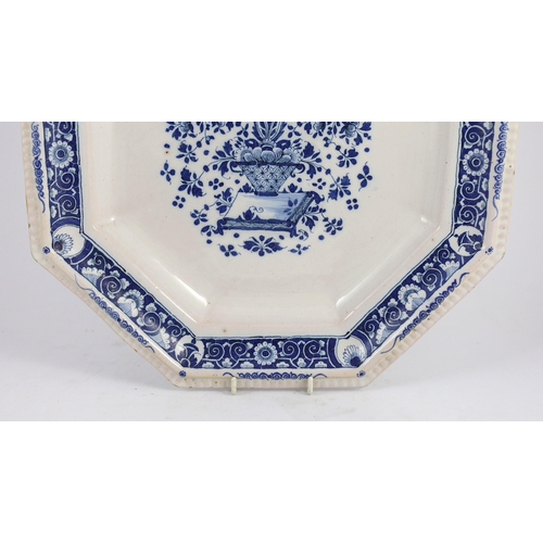 259 - A large Strasbourg faience octagonal dish, c.1720-40, painted in blue with a basket of flowers, with... 