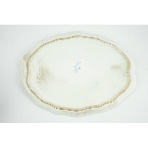 262 - A Sevres porcelain shaped oval tray, date code for 1754, probably later decorated with a central flo... 