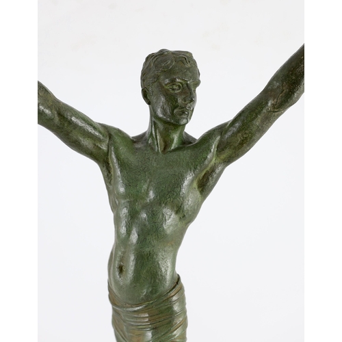 286 - J. Darcourt. NB. An Art Deco patinated spelter figure of a victorious athlete, standing with arms al... 