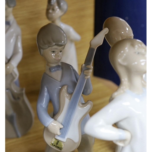 302 - A Lladro collection: seven figures, five further damaged figures and a Lladro reference book