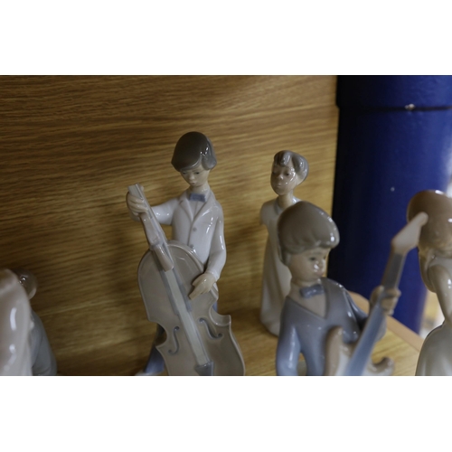 302 - A Lladro collection: seven figures, five further damaged figures and a Lladro reference book