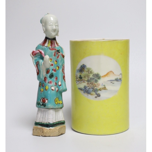 311 - A Chinese yellow ground cylindrical brush pot, Republic period and a Jiaqing famille rose figure of ... 