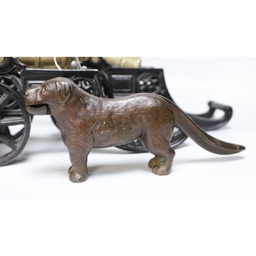 312 - A pair of cast iron and bronze model cannons and a cast iron dog nut cracker, cannons 42.5cm long... 