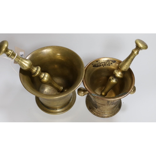 317 - Two 18th/19th century brass mortars, with pestles