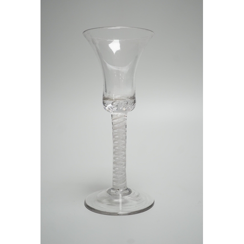 323 - An 18th century Double series opaque twist stem wine glass. 18.5cm tall