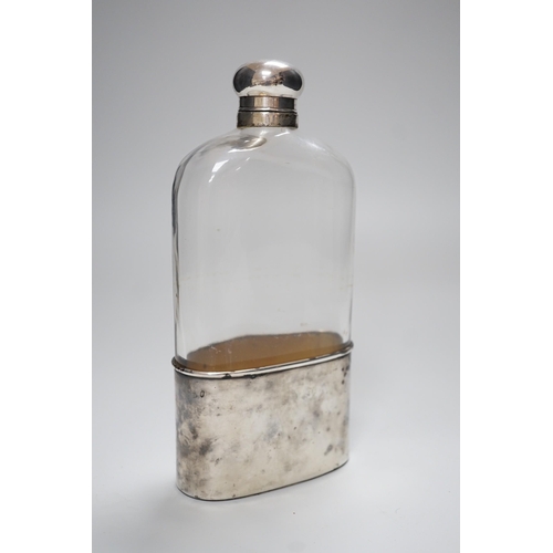 330 - A Goliath size silver plate mounted hip flask, 23.5cm