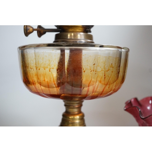 351 - A Victorian brass and cranberry glass oil lamp