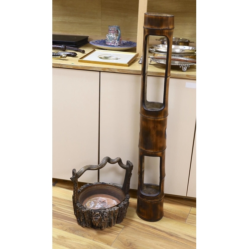 369 - A Japanese Ikebana wood basket, together with a tall bamboo sectional Ikebana vase. Tallest 102cm... 