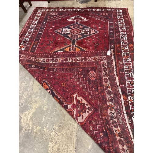 37 - A Caucasian style red ground carpet, 270 x 168cm