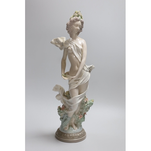 376 - A Lladro figure of a maiden, decorators signature on base, No 40141 cms.