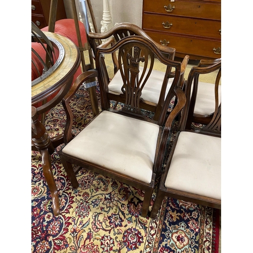 38 - A set of seven George III style mahogany dining chairs, one with arms, together with a similar elbow... 