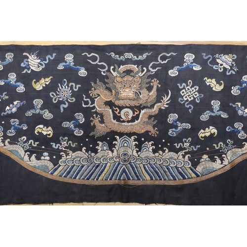 389 - A Chinese late 19th century embroidery of a dragon, probably from a Chinese robe or hanging 37x105cm... 