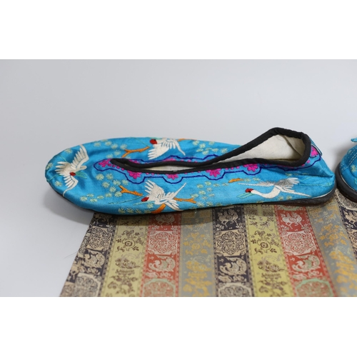 395 - A pair of Chinese silkwork slippers and a Japanese table runner