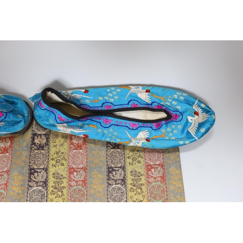 395 - A pair of Chinese silkwork slippers and a Japanese table runner