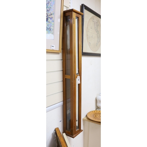 398 - A marine barometer in a mahogany case, 118x17cm