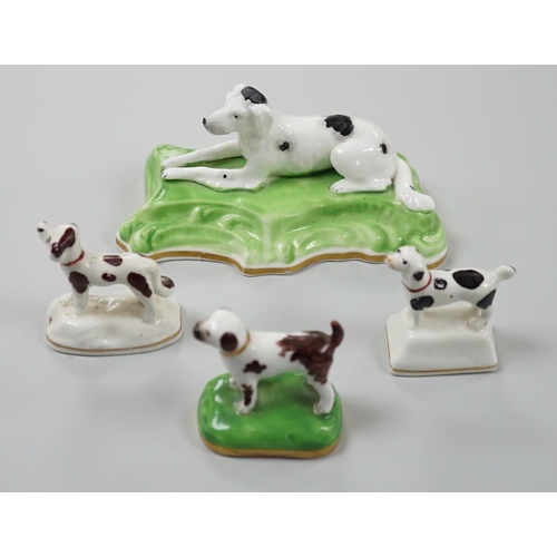 415 - Three toy Staffordshire models of standing terriers; two with brown spots and the other black spots,... 