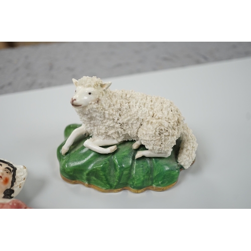 417 - Three small Staffordshire models of recumbent sheep on oval mounted bases, together with a Staffords... 