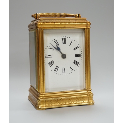 418 - A late 19th century French eight day timepiece, in an engraved brass gorge case. 12cm tall