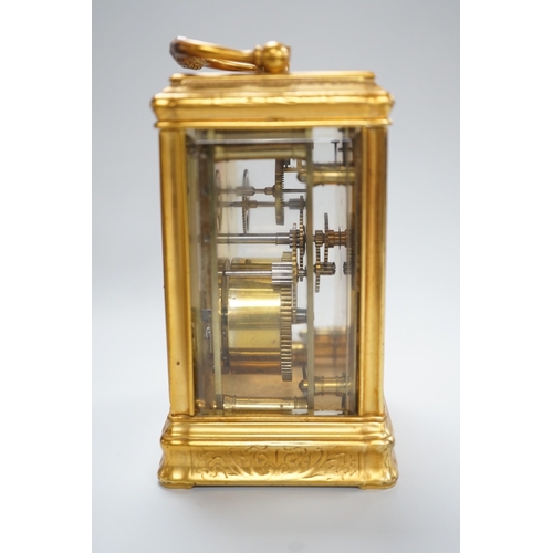 418 - A late 19th century French eight day timepiece, in an engraved brass gorge case. 12cm tall