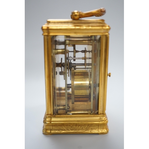 418 - A late 19th century French eight day timepiece, in an engraved brass gorge case. 12cm tall