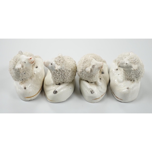 423 - Four small Staffordshire models of recumbent sheep, c.1830-50. 8.5cm longProvenance: Dennis G.Rice c... 