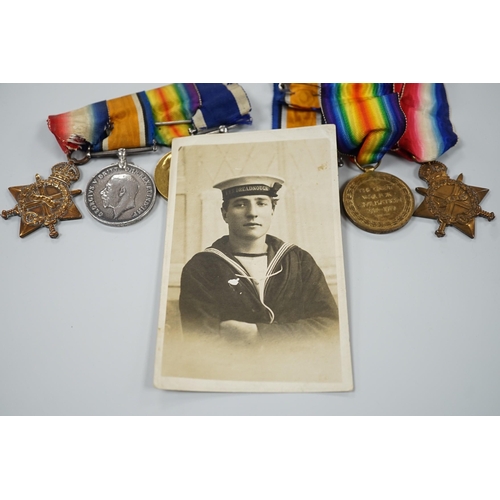 443 - A WWI naval medal group of four with portrait photo with records and one other WWI trio